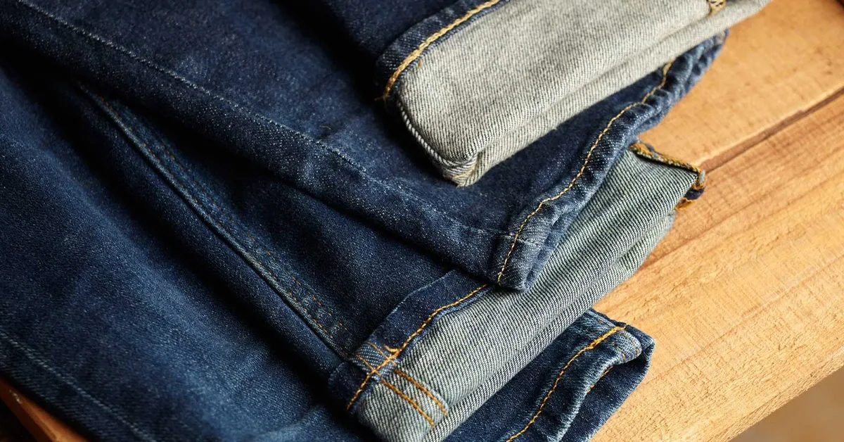 pairs of denim jeans on a table