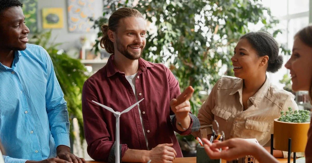 people at a table planning a sustainable lifestyle on a budget